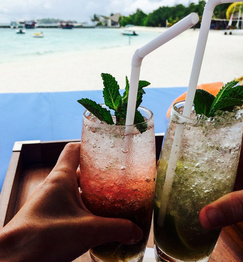 Fruity cocktails on the beach, happy travelling dreams and memories